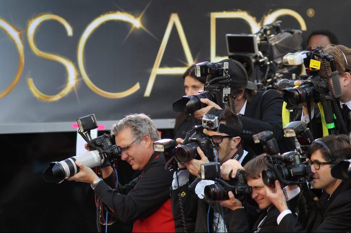 Photographers cover the red carpet arrivals to the 85th Annual Academy Awards at the Hollywood & Highland Center on February 24, 2012 in Hollywood, California.