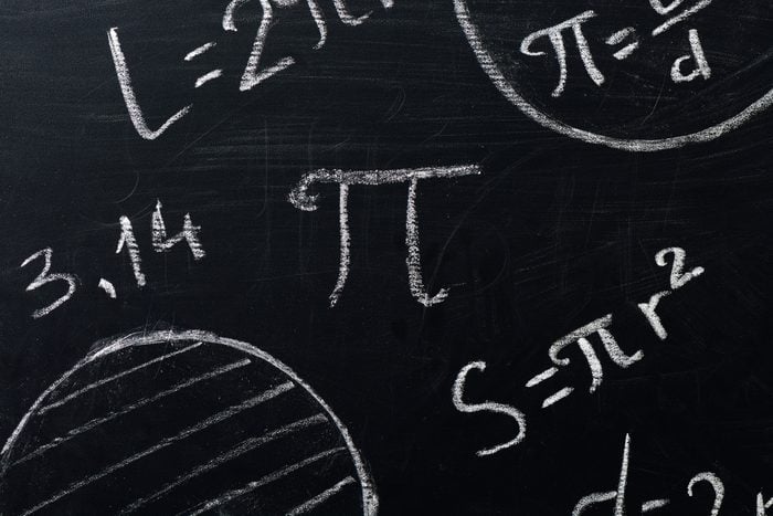 PI symbols and circle formulas drawn on a chalkboard