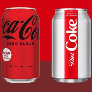 can of coke zero next to a can of diet coke on red background