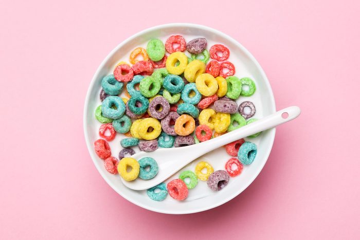 bowl of colorful cereal on a pink background