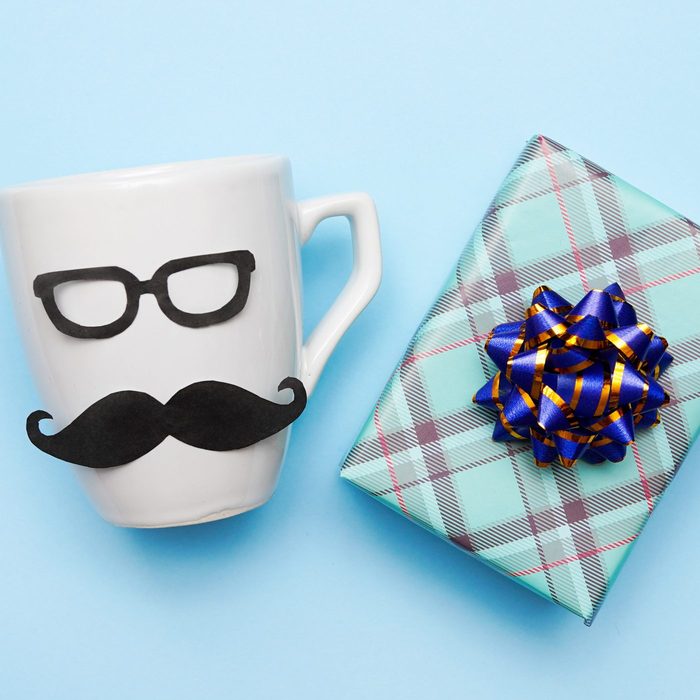 handmade White male cup and gift box on blue background, father's day present . step 4