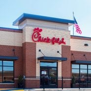 exterior of a Chick-fil-A restaurant with an American flag