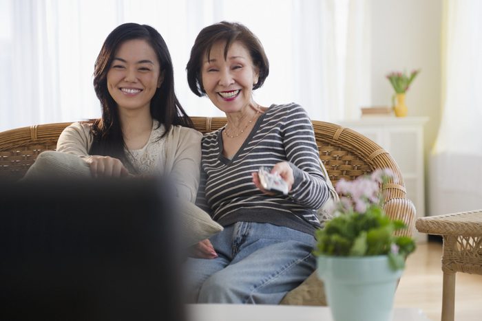 Japanese mother and daughter watching television