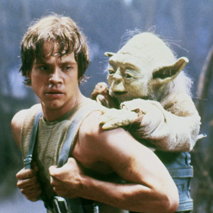 Mark Hamill on the set of Star Wars: Episode V - The Empire Strikes with Yoda on his back