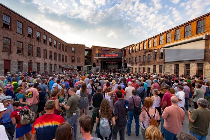 Crowd of people outside for a festival at MASS MoCA in North Adams