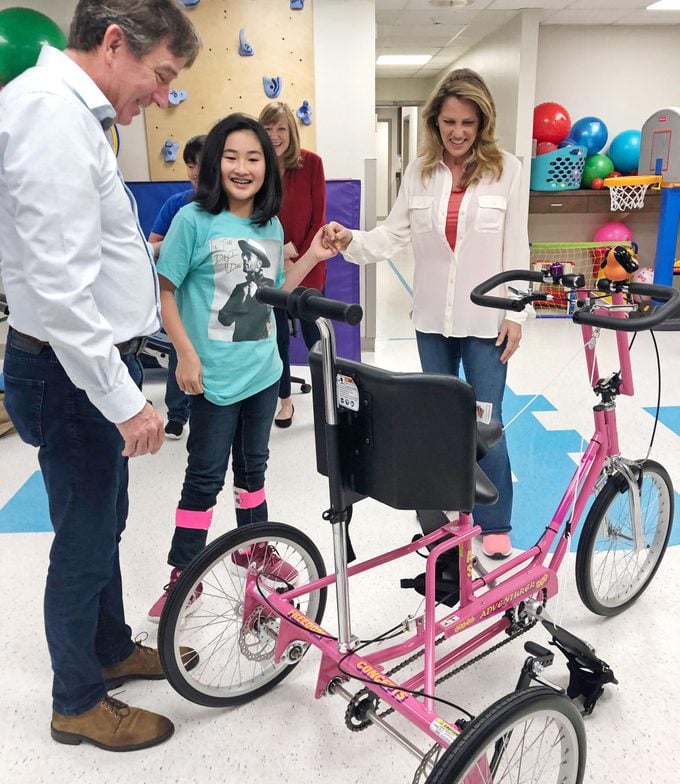 young girl recieves her accessible bike