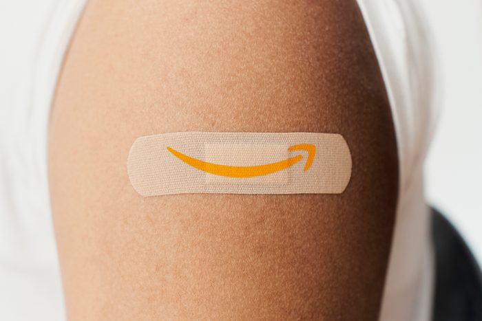 Bandaid with Amazon logo on a person's arm