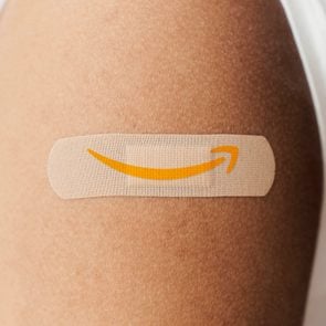 Bandaid with Amazon logo on a person's arm