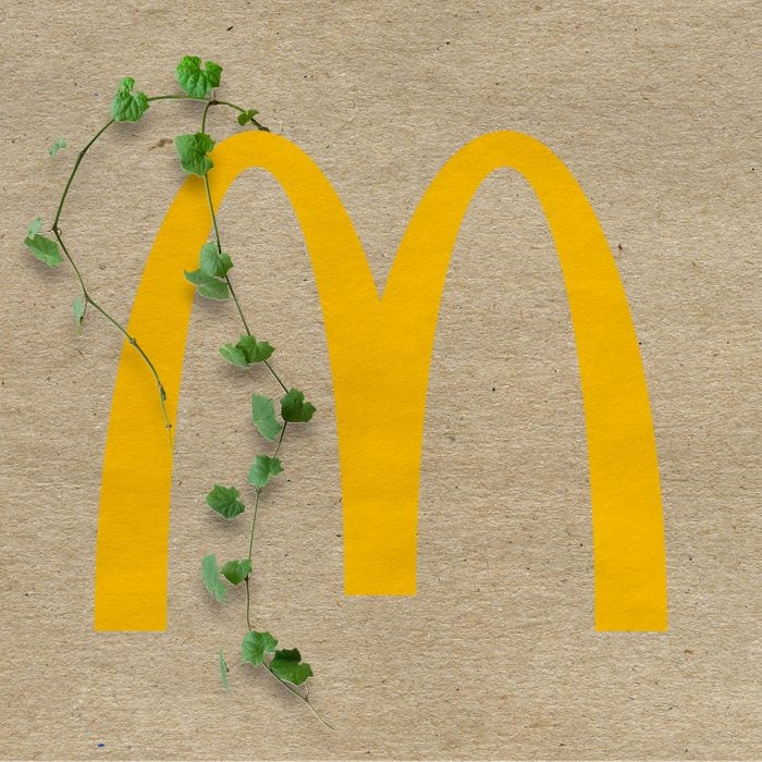 McDonald's logo with vines growing out on a kraft paper background