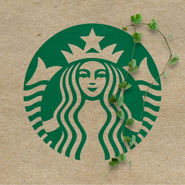 Starbucks logo with vines growing out on a kraft paper background
