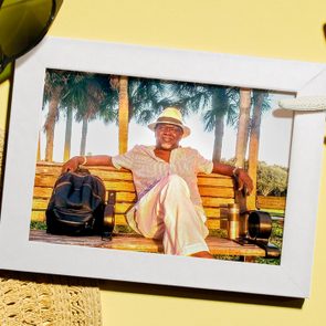 Photo of a man sitting on a bench