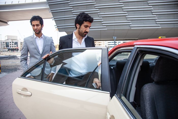 Businessmen traveling by taxi