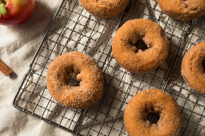 Homemade Apple Cider Donuts on a cooling rack