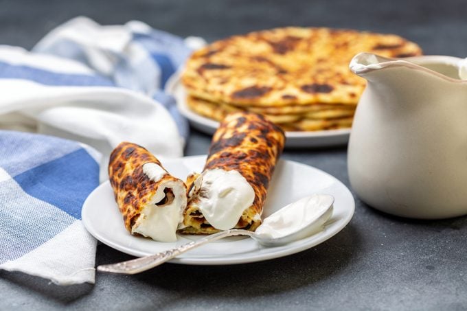 Homemade potato pancakes lefse with cream