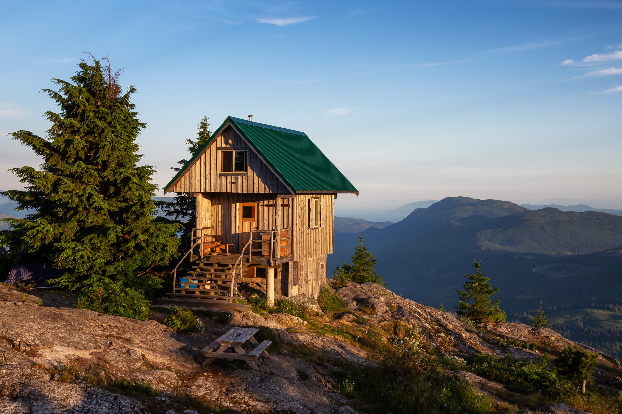 View of Tin Hat Cabin on top of a mountain during a sunny summer evening. Located near Powell River, Sunshine Coast, British Columbia, Canada.