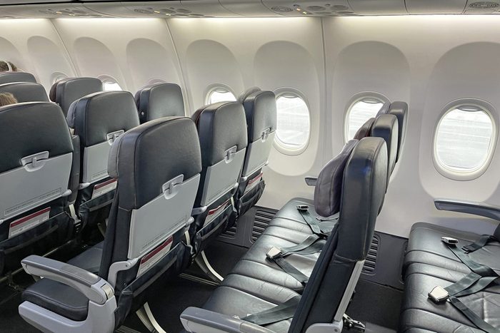 Rows of empty seats in airplane cabin, COVID 19, coronavirus pandemic