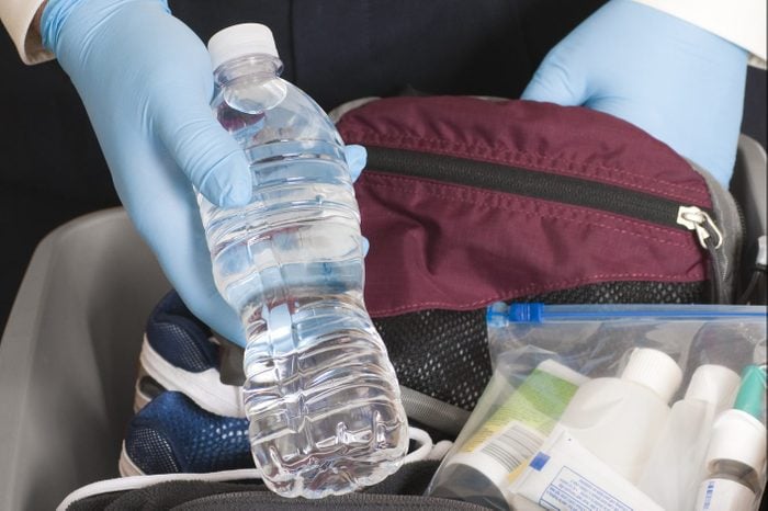 Airport Security TSA Agent Finds a Bottle of Water