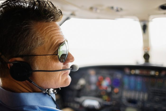 Man in cockpit of airplane
