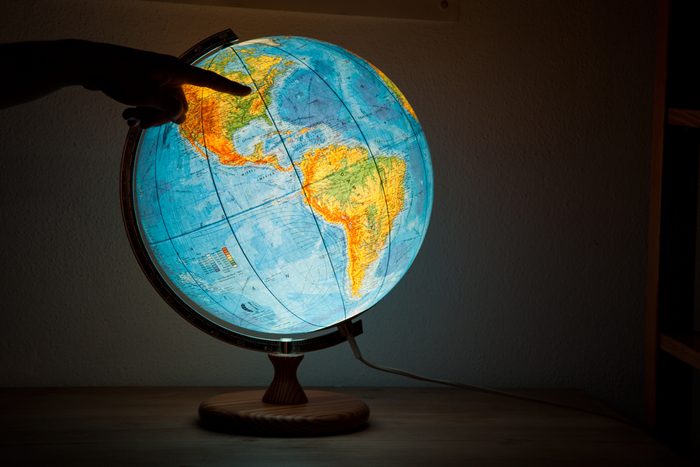 glowing Globe Lamp with finger pointing