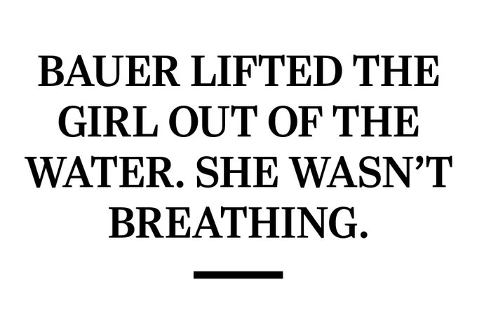 Bauer lifted the girl out of the water. She wasn't breathing.