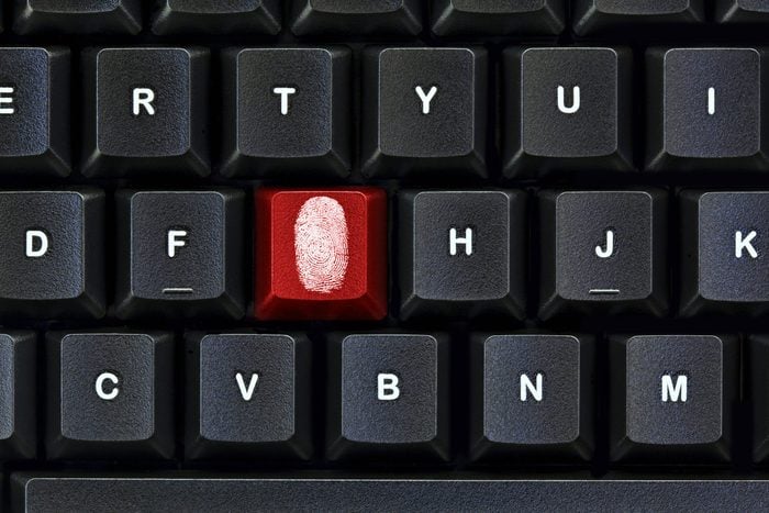 Red key, white fingerprint on a black keyboard