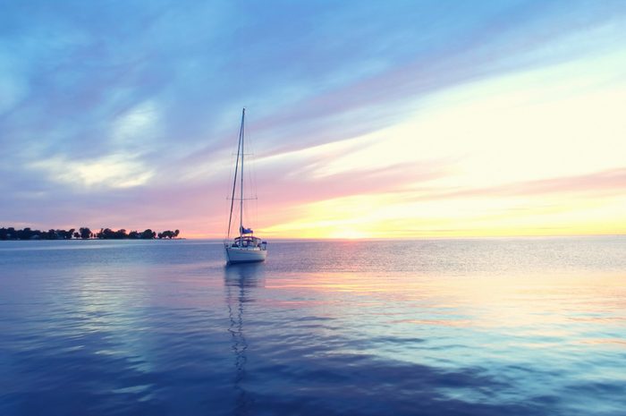 Peaceful sailboat at sunset