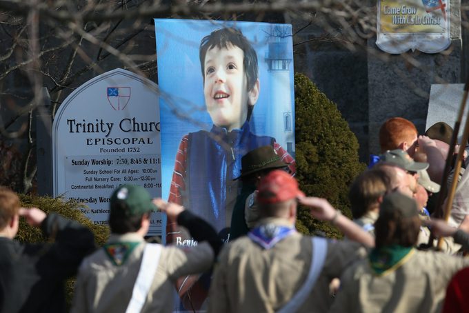 Boy scouts salute as a funeral procession for Benjamin Wheeler, 6, enters the Trinity Episcopal Church on December 20, 2012 in Newtown, Connecticut.