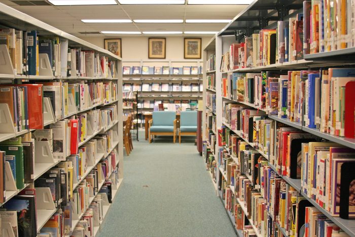 A library aisle of book shelves