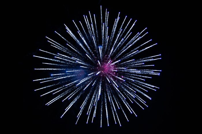 Low Angle View Of Firework Against Sky At Night