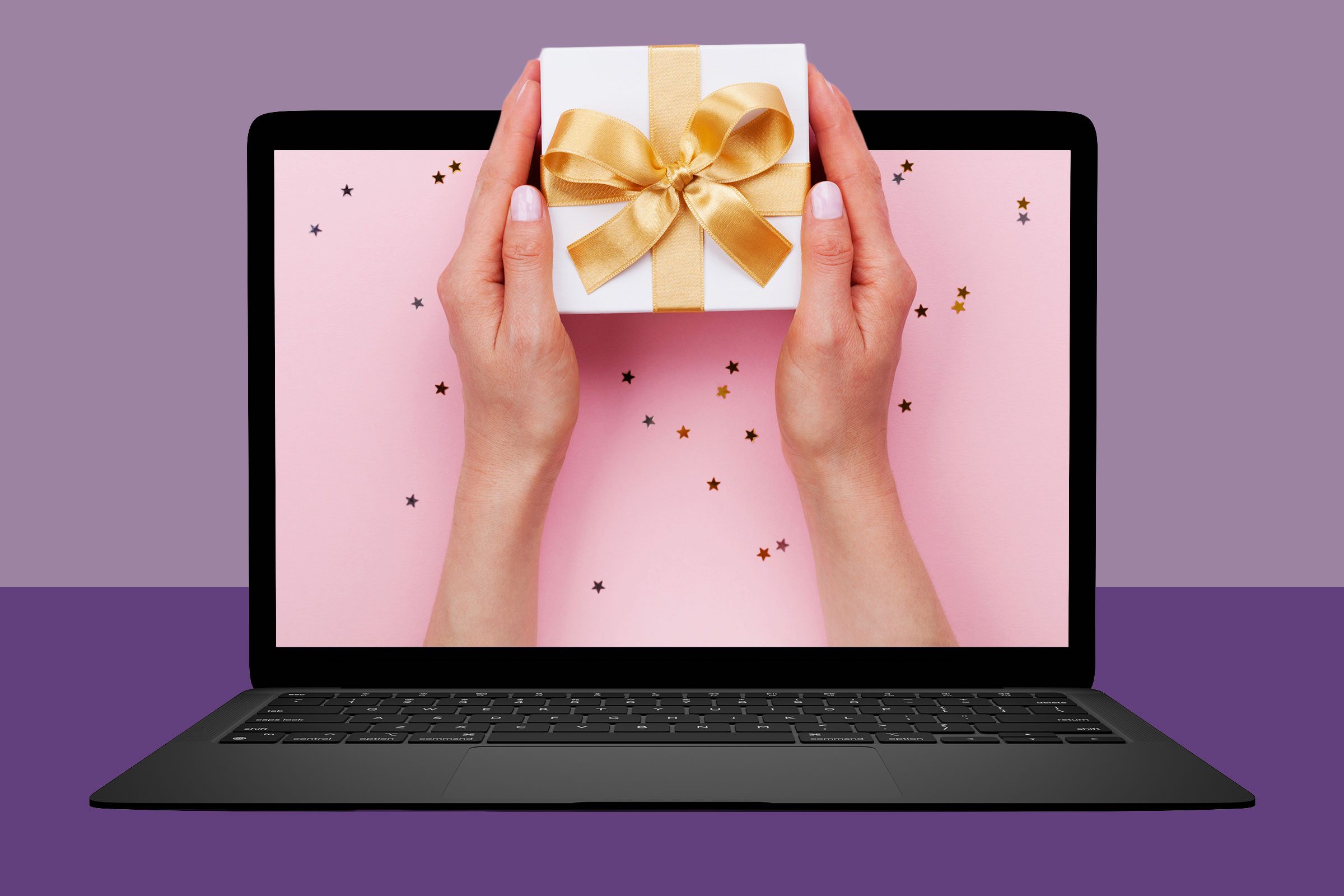 hand holding gift coming out of computer screen
