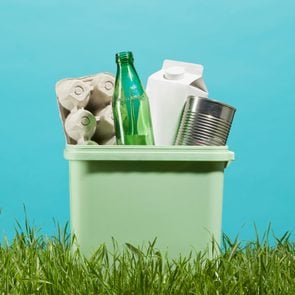 Recycling bin with cardboard, glass, and metal