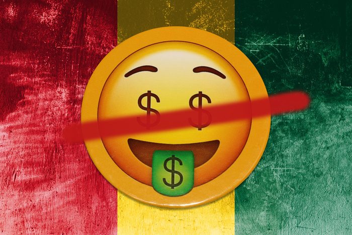 red, yellow, and green juneteenth background with crossed out moneyface emoji on top