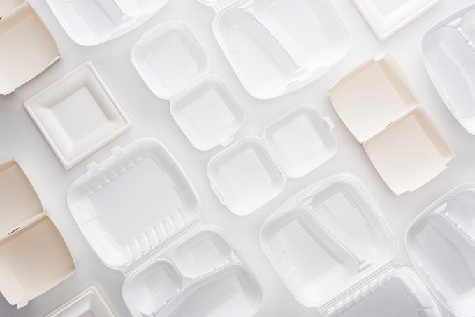 different disposable food containers on white background top view