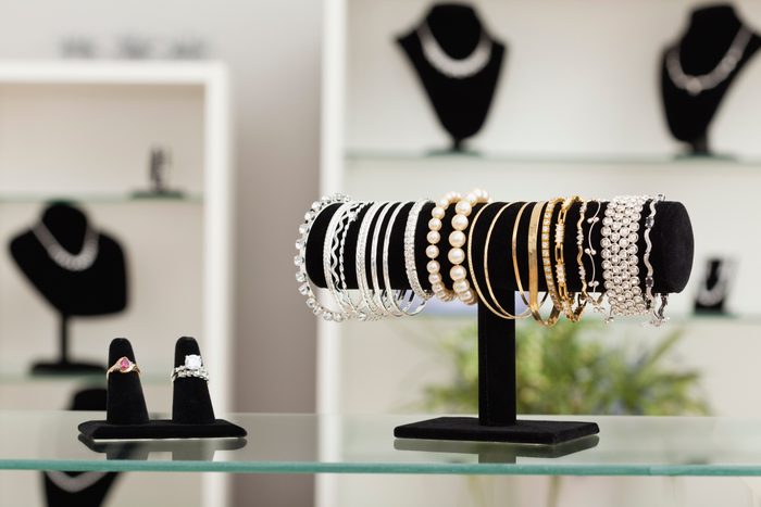 USA, Illinois, Metamora, bracelets and rings on display in jewelry store