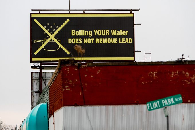 a billboard in Flint, Michigin that reads "boiling your water does not remove lead"