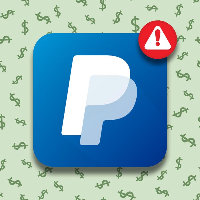 paypal app with a green dollar sign background and a warning symbol notification