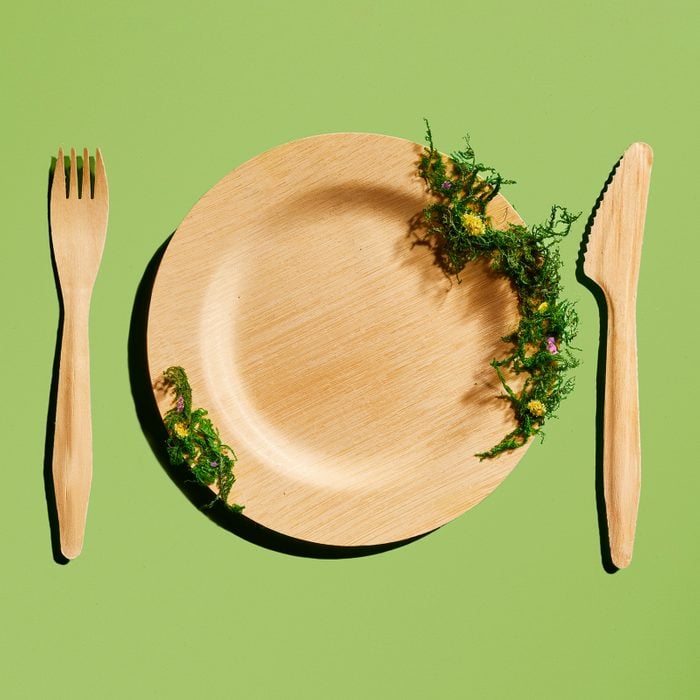 Bamboo eating utensils on a green background
