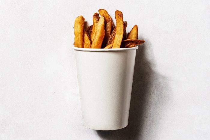Close up of five guys fries in a white cup