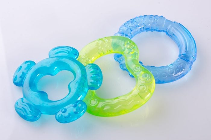 Close-Up Of Baby Teethers Against White Background