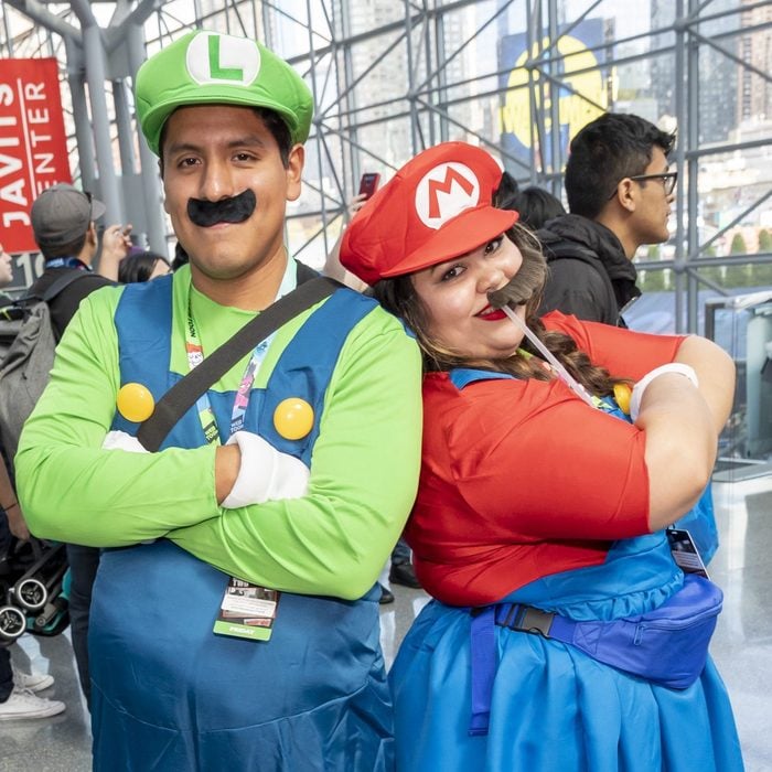 Comic Con attendees pose in the costumes during Comic Con...