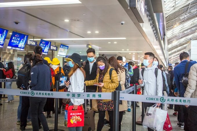 Passengers in line scan the code and fill in the health registration form in Chengdu Shuangliu International Airport as required