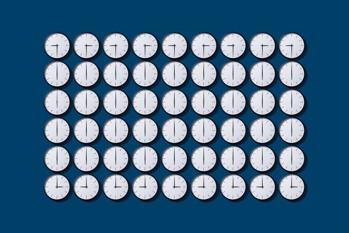 grid of clocks with arranged Clock Hands that create a grid