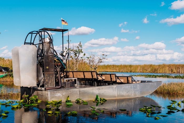 Airboat in lake at Everglades National Park against blue sky