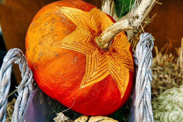 decorated pumpkin. carvings in a decorative pumpkin. Harvest festival. Craftsmanship