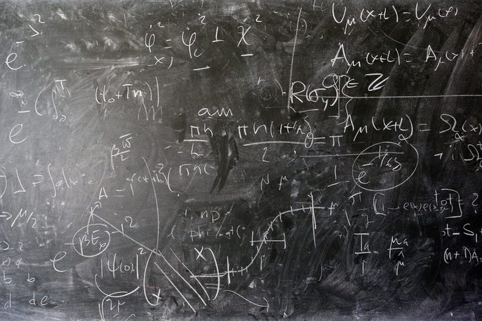 mathematical equations on a chalk board