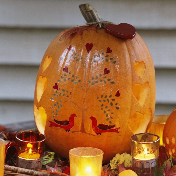 Carved and Painted Pumpkin with Votive Candles