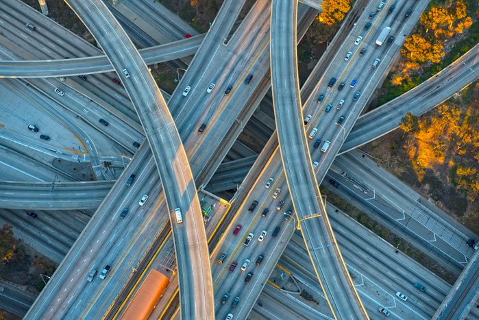 Aerial view of cars driving on highway interchange