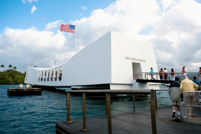 American flag fluttering on a memorial building, USS Arizona Memorial, Pearl Harbor, Honolulu, Oahu, Hawaii Islands, USA