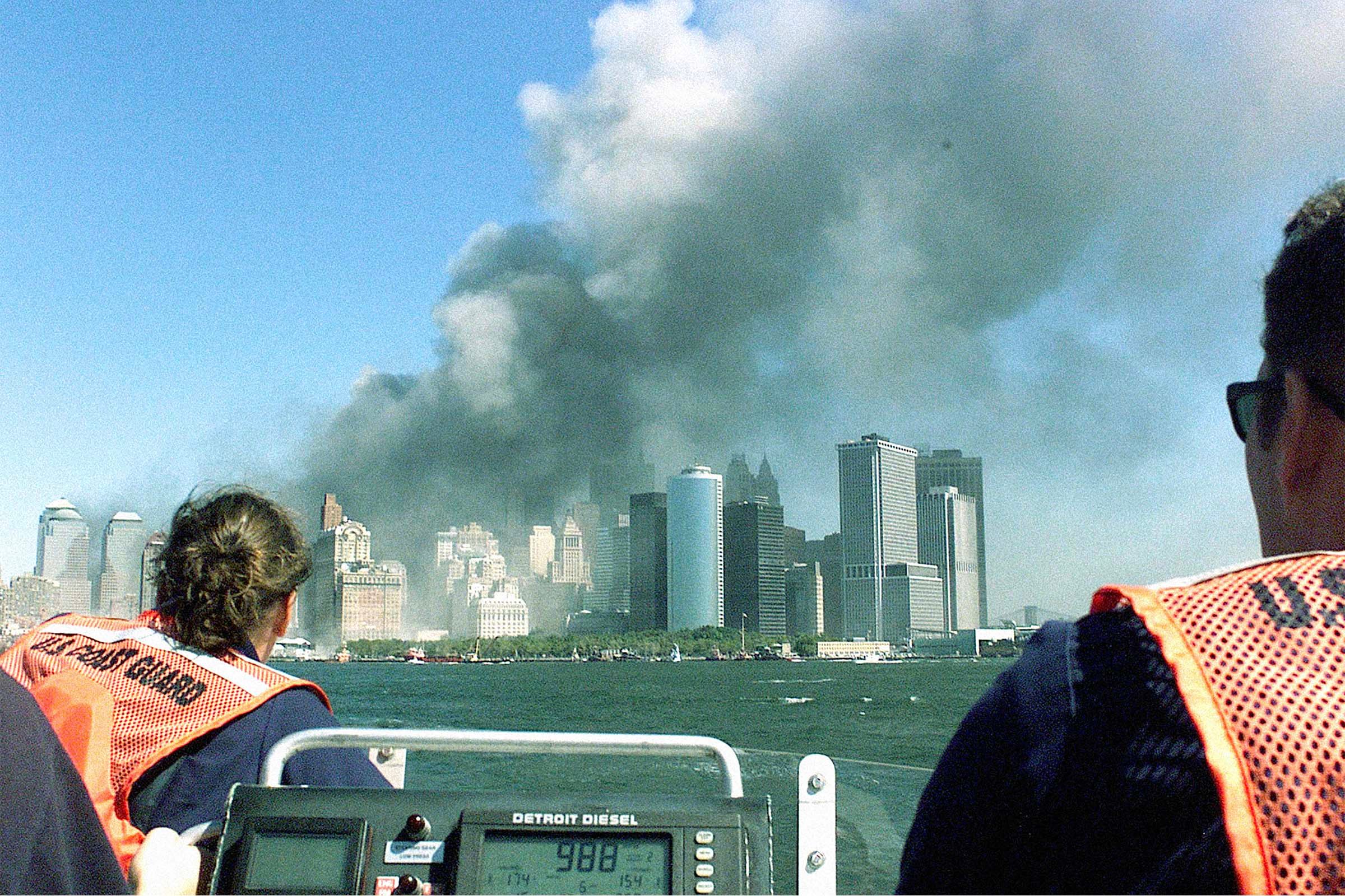 Two coast guard crew members watching the twin towers