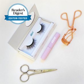 doe magnetic lashes in a box with other beauty accessories next to it
